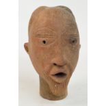 A 17th century terracotta Noc head, height 26cm.