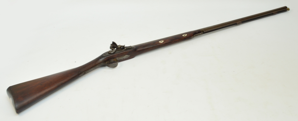 A 19th century flintlock musket with chequered walnut stock, with ramrod, indistinct markings to the