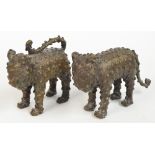 A pair od 20th century Cameroon bronze figures of standing leopards with "spotty" decoration,