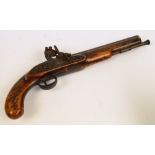 WITHDRAWN.

A 19th century flintlock pistol with brass furniture and stained beech stock, overall