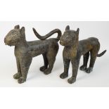 A pair of 17th century Benin bronze leopards with punched and raised decoration and modelled