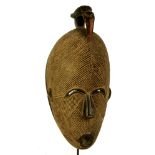 A Guru mask, Ivory Coast, with horn bill surmount,