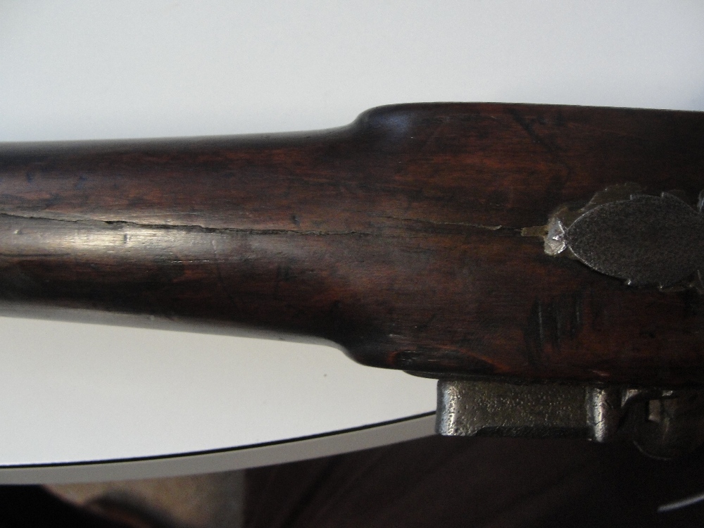 A 19th century flintlock musket with chequered walnut stock, with ramrod, indistinct markings to the - Image 3 of 5