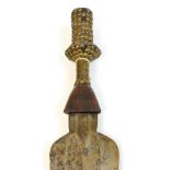 A Kuba Ikul dagger, Congo, with shaped blade and stud decoration to the wooden handle, length 49cm.