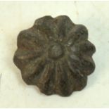 A Viking bronze flower head belt adornment, diameter 1.5cm.