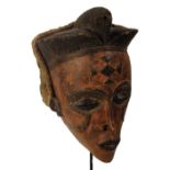 A Tschokwe (Chokwe) Pwo mask, Angola, with raised coiffeur,
