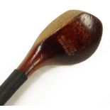 A Robert Simpson 1894 patent driver, the head made from hornite, with sole plate and leather grip.