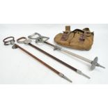 A vintage canvas and leather strap bound fishing bag, and three shooting sticks (4).