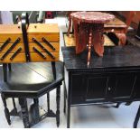 An octagonal ebonised hall table, a carved Oriental style stool,