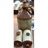 Two vintage stoneware hot water bottles and two large vintage stoneware storage jugs, one for "