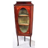 An Edwardian mahogany and inlaid corner display cabinet with three interior shelves,