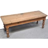 A stripped pine coffee/occasional table on turned legs, length 120cm.