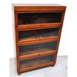 An early 20th century Globe Wernicke oak stacking bookcase comprising four sections,