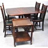 An oak drop leaf dining table, extended length 137cm, four oak dining chairs,