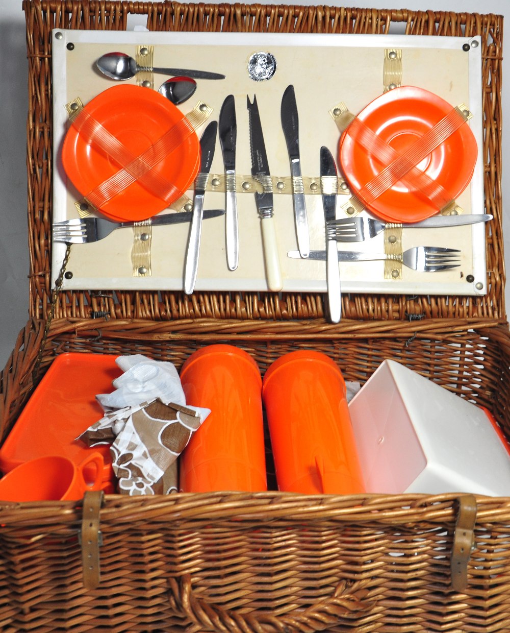 A vintage wicker picnic hamper complete with cups, saucer etc.