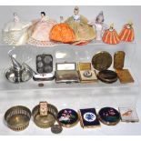 A collectors lot comprising silver plated and base metal vesta cases, miniature dolls, coins,
