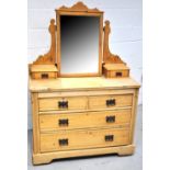 A Victorian stripped pine mirror back dressing table, two small drawers above two long drawers.