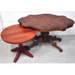 A reproduction shaped occasional table raised on four carved supports, width 100cm,