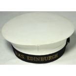 A Vintage sailor's cap with band inscribed "H.M.S. Edinburgh", internal diameter approx 19cm.