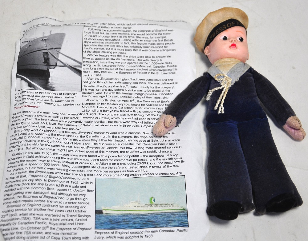 A Norah Wellings doll with velvet body and moulded head and cap inscribed "Empress of England",