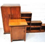 A 20th century walnut cabinet with three interior shelves on bracket feet,