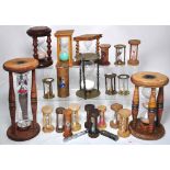 Approximately 25 assorted hour glasses and egg timers of assorted types and styles.