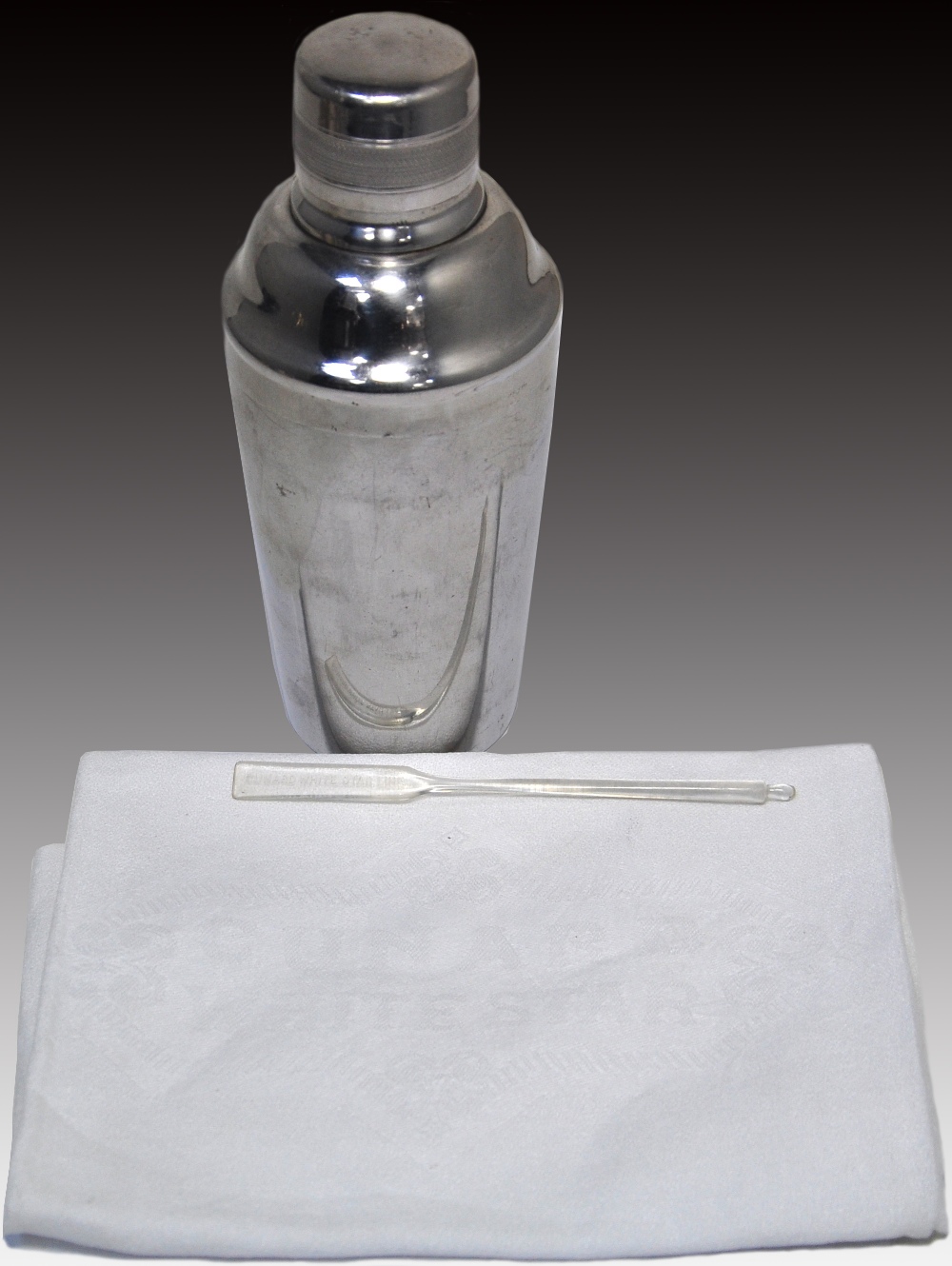 A stainless steel staybright cocktail shaker, number to the base 36942 and engraved" F.P.