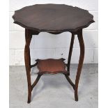 An Edwardian mahogany occasional side table on cabriole legs with lower moulded shelf,