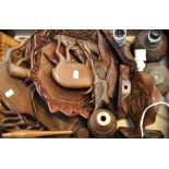 A quantity of treen items to include a bowl, wall masks and table lamps.