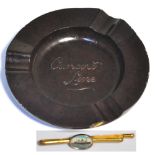 A Cunard Line ashtray made by Fraser and Glass Ltd and a Queen Elizabeth Line tiepin (2).