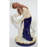 A Royal Dux Art Deco figure group of a scantily clad maiden feeding a deer, with pink triangle