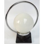 An Art Deco style chrome table lamp with opaque globular shade.