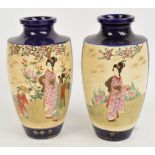 A pair of 20th century Japanese Satsuma baluster shaped vases decorated with panels of figures in