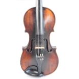 A full size German violin with one-piece back and carved scroll, unlabelled, length of back 35.6cm.