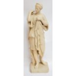 A late 19th century composition figure of a classical woman wearing a robe, stamped "Bruciotti" to