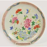 An 18th century Chinese charger painted in Famille Rose enamels with floral sprays, unmarked,