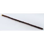 A thorn walking cane with turned ivory pommel, length 99cm.