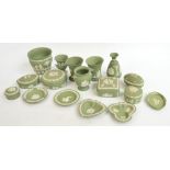 Seventeen pieces of Wedgwood green jasperware including vases, trinket boxes etc.