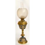 A late 19th century Doulton stoneware and brass mounted oil lamp, with leaf decorated reservoir,