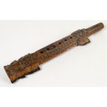 A decorative 20th century Eastern carved hardwood musical instrument,