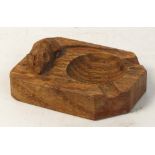 A Robert "Mouseman" Thompson carved oak ashtray, length 10cm.