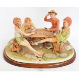 A large Capodimonte figure group, the card players, incised to base "Corlese" and on wooden plinth,