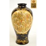 A Japanese Meiji period baluster vase, finely painted with two oval panels depicting haloed