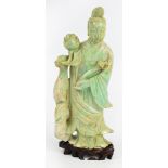 An early 20th century Chinese carved hardstone figure of Guanyin holding a ruyi sceptre and