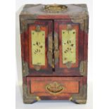 A 20th century Chinese miniature cabinet with hardstone inlaid doors.