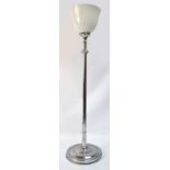 An Art Deco style chromed uplighter with adjustable central column and dished circular base.