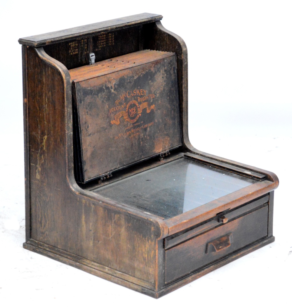 A large early 20th century oak 'The McCaskey Account Register' with tin stacking receipt trays and - Image 2 of 2