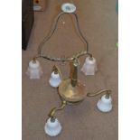 An early 20th century three branch pendant light with opaque white fruit moulded shades,