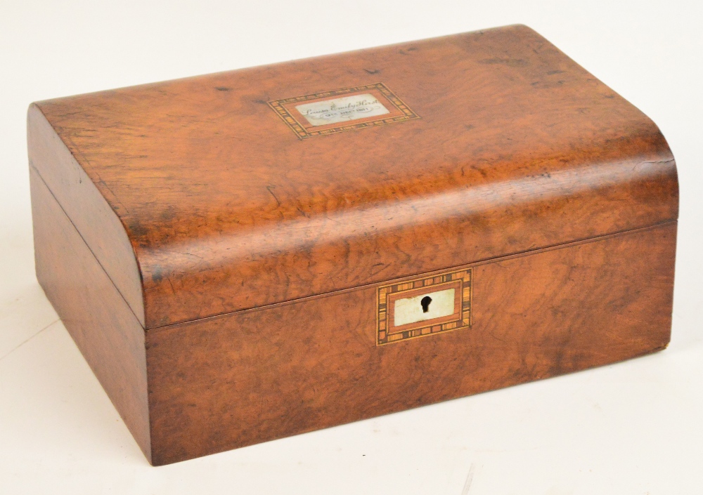 A late 19th century walnut dressing box with mother of pearl cartouche surrounded by inlay,