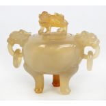 A c.1900 Chinese agate tripod censer and cover, the finial carved as a lion and with carved lion